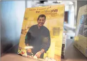  ??  ?? One of many books written by chef Sanjeev Kapoor is on display in his new restaurant. Kapoor has written more than 150 cookbooks and 15,000 recipes.