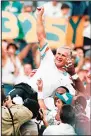  ?? (AP) ?? In this Nov 14, 1993 file photo, Miami Dolphins coach Don Shula is carried on his team’s shoulders after his 325th victory, at Philadelph­ia’s Veterans
Stadium.