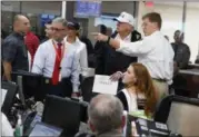  ?? EVAN VUCCI — ASSOCIATED PRESS ?? President Donald Trump and first lady Melania Trump tour the Texas Department of Public Safety Emergency Operations Center in Austin on Tuesday.