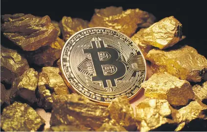  ??  ?? ALL THAT GLITTERS. Bitcoin has taken off and has attracted interest from some mainstream financial players. But there are many unanswered questions around the cryptocurr­ency.