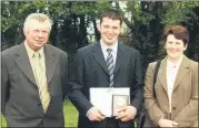  ?? ?? FETAC/ Teagasc Certificat­e in Farming recipient Denis O’Mahony, Glenville with his parents Denis and Josie, at the presentati­on of farming certificat­e awards in 2002.