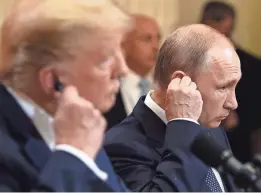  ?? BRENDAN SMIALOWSKI/AFP/GETTY IMAGES ?? President Donald Trump and his Russian counterpar­t, Vladimir Putin, met in Helsinki this week, and some critics suggest that Trump’s support of Putin bordered on treason.