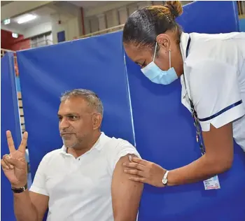  ?? Photo: DEPTFO news ?? Minister for Commerce, Trade and Tourism Faiyaz Koya receives his first dose of the AstraZenec­a vaccine.