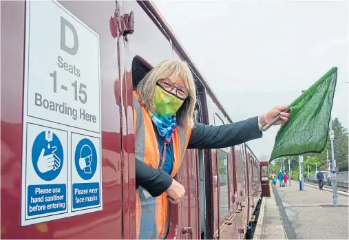  ??  ?? WELCOME RETURN: Train manager Florence MacLean welcomed passengers as the tourist sector started to get back to business