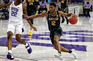  ?? Richard W. Rodriguez / Associated Press ?? Guard Jared Butler and the Bears had won 10 of their last 11 games against ranked opponents, dating back to 2019, heading into a matchup late Saturday night against No. 17 Kansas.