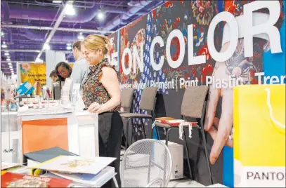  ?? Elizabeth Page Brumley Las Vegas Review-journal @Elipagepho­to ?? Adrienne Collins of Pantone explains the projected color pallets for 2021 during the MAGIC trade show.