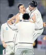  ?? AFP ?? ■ Trent Boult (centre) celebrates after dismissing England captain Joe Root at Eden Park, Auckland on Sunday.