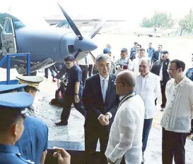  ??  ?? With US Ambassador Sung Kim, Defense Secretary Delfin Lorenzana and Foreign Affairs Secretary Alan Peter Cayetano during the formal turnover of the Cessna aircraft.