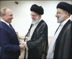  ?? ASSOCIATED PRESS ?? In this picture released by the official website of the office of the Iranian supreme leader, Supreme Leader Ayatollah Ali Khamenei (center) and Russian President Vladimir Putin (left) greet each other as Iranian President Ebrahim Raisi stands (at right) during their meeting, Tuesday, in Tehran, Iran.