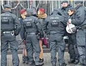 ??  ?? Women took to the streets for the Cologne Carnival yesterday, watched over by more than 2,000 officers tasked with ensuring security after the New Year’s Eve sex attacks