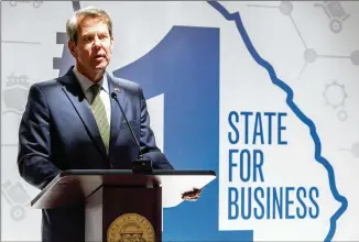  ?? NATHAN POSNER FOR THE AJC ?? Gov. Brian Kemp, at a news conference Tuesday at the state Capitol in response to African American religious leaders calling for a boycott of Home Depot over Georgia’s new voting law, called the retaliatio­n against businesses for not opposing the law “absolutely ridiculous” and harmful.