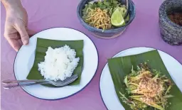  ??  ?? A plate of jasmine rice on a banana leaf is pictured on Dec. 15, 2020, in Scottsdale. Alex and Yotaka Martin cook Thai cuisine for their food pop-up, Lom Wong, which is currently available for pickup once a week.