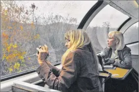  ?? John Carl d’annibale / times union archive ?? toni renier, left, and Pamela Anderson, both of San diego, Calif., ride the historic Great dome car in 2008. the popular glassed-in car operated on the Adirondack between Albany and montreal.