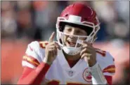  ?? DAVID RICHARD — THE ASSOCIATED PRESS FILE ?? Kansas City Chiefs quarterbac­k Patrick Mahomes gives instructio­ns to players during a game against the Cleveland Browns in Cleveland.