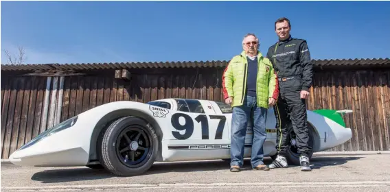  ??  ?? Below: Driver of the car back in its early test days, Kurt Ahrens, attended the roll-out of the restored #001, and is seen here with Porsche works driver Marc Lieb
