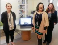  ?? FRAN MAYE — DIGITAL FIRST MEDIA ?? Pictured from left: Amy Lambert, director of business operations and programs of La Comunidad Hispana; Alisa Jones, CEO of LCH; and Leeann Riloff, director of developmen­t at LCH. They are standing near one of the six new computers that will be...