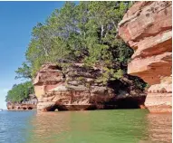  ?? CHELSEY LEWIS/MILWAUKEE JOURNAL SENTINEL ?? Boats and kayaks are the best way to get an up-close view of the sea caves in the Apostle Islands National Lakeshore.