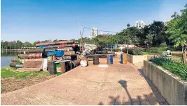  ?? PHOTOS BY OY KANJANAVAN­IT FB ?? The jogging track at Benjakitti Park before it was cleared of obstacles this week. Remnants of a stage sat there, blocking the track, for two months.