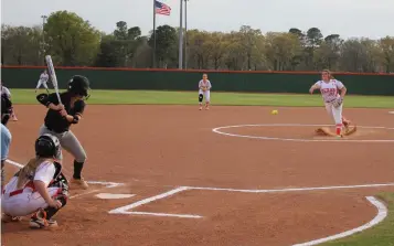  ?? Staff photo by Josh Richert ?? ■ Texas High pitcher Mabry Smith throws a pitch to Mount Pleasant batter Blakely Cheek for a strikeout during a District 16-5A softball game Friday at Lady Tiger Field. Kylee Spriggs is the THS catcher.