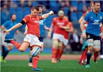  ?? AFP ?? Wales’ fly-half Dan Biggar kicks the ball during the Six Nations match against Wales at the Stadio Olimpico in Rome. —