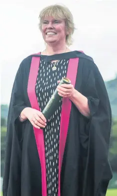  ??  ?? Top teacher Elaine Wyllie received a Masters of Arts from Stirling University for her outstandin­g contributi­on to the community with the Daily Mile initiative which was started at St Ninians Primary School in Stirling.