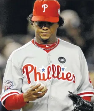  ?? AP FILE PHOTO/DAVID J. PHILLIP ?? The Philadelph­ia Phillies’ Pedro Martinez looks at the baseball after giving up a two-run home run to the New York Yankees’ Hideki Matsui during the second inning of Game 6 of the 2009 World Series.