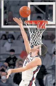  ?? AP ?? Gonzaga forward Drew Timme scores inside against Virginia during the first half on Saturday in Fort Worth, Texas.
