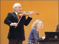  ?? DEAN HANSON/JOURNAL ?? Violinist Krzysztof Zimowski and pianist Pamela Pyle perform a work by Polish composer Henryk Wieniawski Friday.