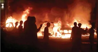  ?? — AFP photo ?? Fires burn downtown during a second night of rioting in Kenosha, Wisconsin.