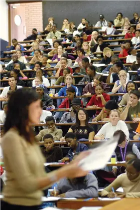  ??  ?? Students at a lecture at UJ. Tertiary institutio­ns bucked the trend when it comes to inflation costs.