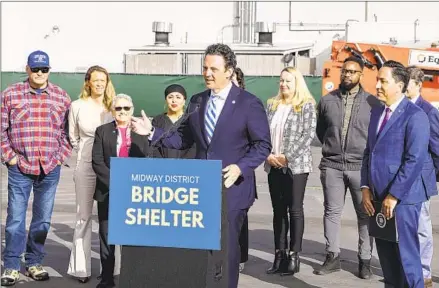  ?? EDUARDO CONTRERAS U-T ?? County Supervisor Nathan Fletcher speaks at a news conference Tuesday about the constructi­on of a shelter in the Midway District.