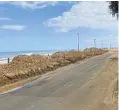  ?? ?? Sand had to be cleared from North Beach Road, Umdloti Beach, after being washed down the hillside by heavy rains.