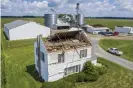  ??  ?? Destructio­n left by the storm in Wakarusa, Indiana on 11 August. Photograph: Robert Franklin/AP