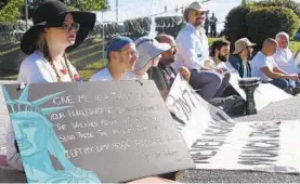  ?? XAVIER PLATER/BALTIMORE SUN ?? Baltimore Jews against ICE along with various community groups block the entrance of the Howard County Detention Center.