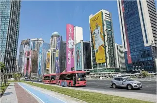  ?? /Bloomberg ?? Play or bust: Shuttle buses in the financial district of Doha, Qatar. Embattled Fifa president Gianni Infantino pushed back on Saturday against criticism of the Qatar World Cup before the tournament began.