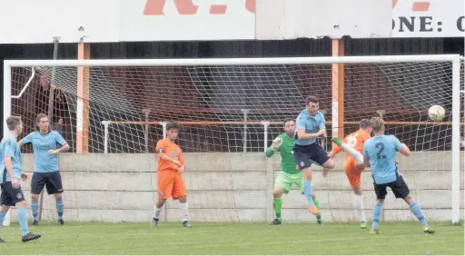  ?? Paul Watson ?? Runcorn Town’s defence comes under pressure against AFC Blackpool in the teams’ FA Vase clash in Lancashire. The visitors held out and secured a 2-0 victory. Full report on page 61.