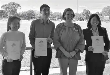  ?? ?? PROUD: Ararat Rural City Council mayor Jo Armstrong, second from right, with, from left, Yingchen Chiu, Sze Long Arnold Kwok and Nai-yun Otte, at an Australian Citizenshi­p ceremony at Ararat.