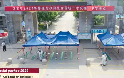  ?? Photo: cnsphoto ?? Members from the Blue Sky Rescue team disinfect a site for gaokao in Xuzhou, East China’s Jiangsu Province on Monday.