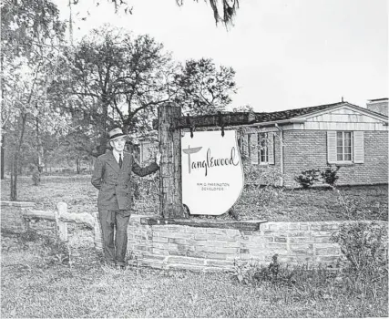  ?? Tanglewood Corp. ?? Real estate developer William Farrington, who created Tanglewood, stands at the entrance to the neighborho­od in 1949.
