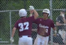  ?? PETE BANNAN — MEDIANEWS GROUP ?? Chichester’s Damian Thompson, left, is congratula­ted by teammate Colin Jones after scoring in the sixth inning against Radnor Monday. Chi scored three times in the sixth for a 3-1 win in the first round of the District 1 Class 5A tournament.