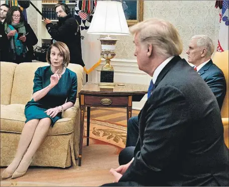  ?? Brendan Smialowski AFP/Getty Images ?? HOUSE Minority Leader Nancy Pelosi argues with President Trump as Vice President Mike Pence looks on. At several points, she and Sen. Charles E. Schumer suggested continuing the conversati­on in private. Trump rejected the idea, saying, “It’s called transparen­cy.”