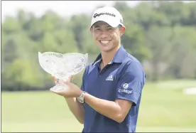  ?? DARRON CUMMINGS — THE ASSOCIATED PRESS ?? Collin Morikawa holds his trophy after winning the Workday Charity Open golf tournament on July 12 in Dublin.