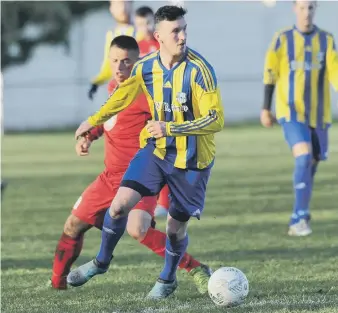  ??  ?? Hylton Castle TWR Group (stripes) take on Sunderland rivals Victoria Gardens in the Durham Sunday Cup.