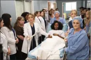  ?? MITCH HAASETH ?? This image released by ABC shows the cast of “Grey’s Anatomy” in a scene from the episode “Silent All These Years,” where female doctors and nurses of Grey Sloan Memorial Hospital lined a hallway to both protect and support a rape victim, who had said every man she saw reminded her of her rapist. After it aired, it led to a 43% increase in calls to the National Sexual Assault Hotline.