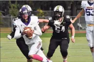  ?? Pete Paguaga / Hearst Connecticu­t Media ?? Westhill quarterbck Jordan Reyes looks for an open receiver against Trumbull on Saturday.