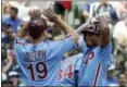  ?? MORRY GASH — THE ASSOCIATED PRESS ?? The Phillies’ Nick Williams celebrates his grand slam with Tommy Joseph during the sixth inning Sunday against the Brewers.