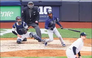  ?? Mike Stobe / Getty Images ?? The Rays’ Manuel Margot hits a two-run home run in the fourth inning against the Yankees at Yankee Stadium on Saturday.