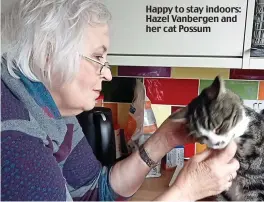  ?? ?? Happy to stay indoors: Hazel Vanbergen and her cat Possum