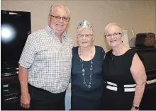  ?? KRIS DUBE THE WELLAND TRIBUNE ?? Alma Gadreau, middle, with her children Larry and Marcelle, at her 100th birthday on Wednesday at St. Charles Village, a retirement community in Welland.