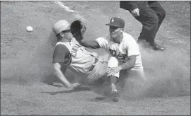  ?? Los Angeles Times ?? THE DODGERS’ Ron Fairly awaits a throw from Daryl Spencer on a double-play attempt in this 1962 game against the Cincinnati Reds.